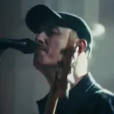 Candlelit live band performance clip at 0:01