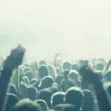 Crowd and stage lights at live show at 0:01