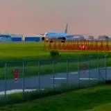 Plane takes off at sunset at 0:01