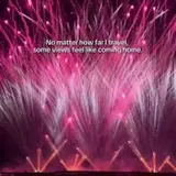 Pink fireworks over dark parking lot at 0:07