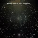 Fireworks burst over dark water at night at 0:01