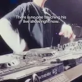 DJ performs live at festival stage at 0:01