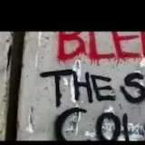 Graffiti message montage with hands and train at 0:03