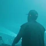 Aerial festival stage lights and crowd at night at 0:44