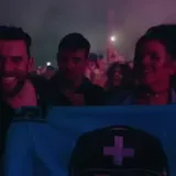 Aerial festival stage lights and crowd at night at 0:22