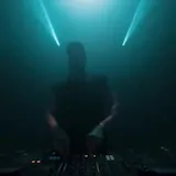 DJ plays live set under laser light show at 0:27