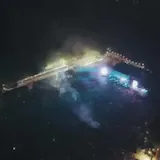 DJ plays live set under laser light show at 0:54