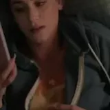 Film scene of girl texting in bed at 0:09