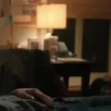 Film scene of girl texting in bed at 0:04