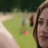 Olive and Adam film scenes in park at 0:01