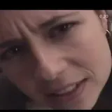 Crying woman close-up then smiling man at 0:01