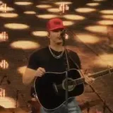 Parker McCollum live singing with guitar at 0:01