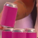 Contestants stack cans with rulers on 99 to Beat at 0:07