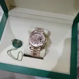 Rolex watch in open green box at 0:04