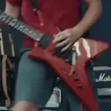 Live band guitar and mosh pit shots at 0:01