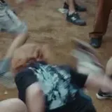 Live band guitar and mosh pit shots at 0:03