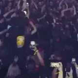 Live band clip with crowd and stage lights at 0:09