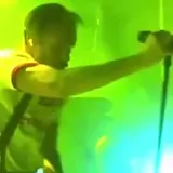 Live band clip with crowd and stage lights at 0:01