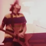 Band performing live on a concert stage at 0:01