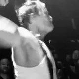 Black-and-white live band crowd footage at 0:01
