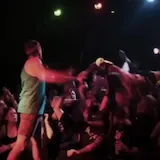 Singer climbs into crowd at live show at 0:21