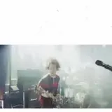 Live concert crowd and band onstage with title card at 0:07