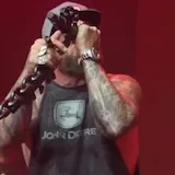 Brantley Gilbert sings live on stage at 0:30