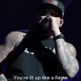 Live concert performance with lyric captions at 0:10