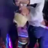 Party crowd dancing in dim club lighting at 1:23