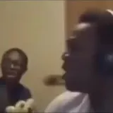 KSI reacts on webcam with friend behind at 0:11
