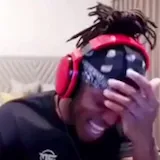 Man in headphones reacts in bedroom at 0:01
