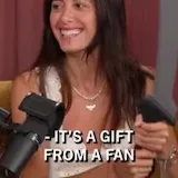 Podcast hosts unbox a knife sent by a fan at 0:19