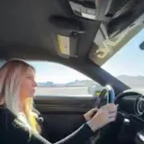 Woman drives Porsche on Speed Vegas track at 0:01