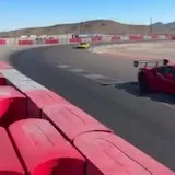 Supercars cornering at Speed Vegas track at 0:22