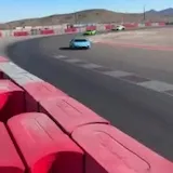 Supercars cornering at Speed Vegas track at 0:14
