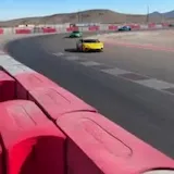 Supercars cornering at Speed Vegas track at 0:07