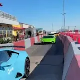 Exotic cars pass on Speed Vegas lane at 0:24