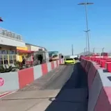 Exotic cars pass on Speed Vegas lane at 0:37