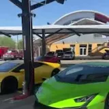 Green Lamborghini parked at Speed Vegas at 0:01