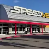 Handheld pan of SPEED VEGAS building exterior at 0:01