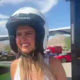 Woman in helmet reacts after Speed Vegas ride at 0:03