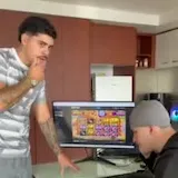 A man answers a National Park Exclusion Register call while his friend at 0:04