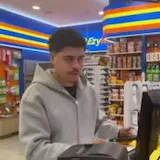 A man buys snacks and shows a Razed win on his phone as his friend says at 0:03