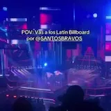 Santos Bravos performs at the Latin Billboard as a fan records from at 0:07