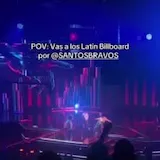 Santos Bravos performs at the Latin Billboard as a fan records from at 0:01