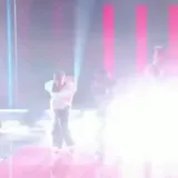 A voice says the performance is in perfect sync with their hit Kawasaki at 1:17