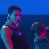 A voice says the performance is in perfect sync with their hit Kawasaki at 0:38