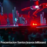 Santos Bravos perform on a neon-lit Billboard stage as five dancers move at 0:10