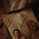 A woman in a straw bed calls it broken and asks a bearded man in armor at 0:01