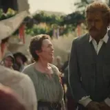 A resident fisherwoman and her husband bless a newlywed couple at their at 0:12